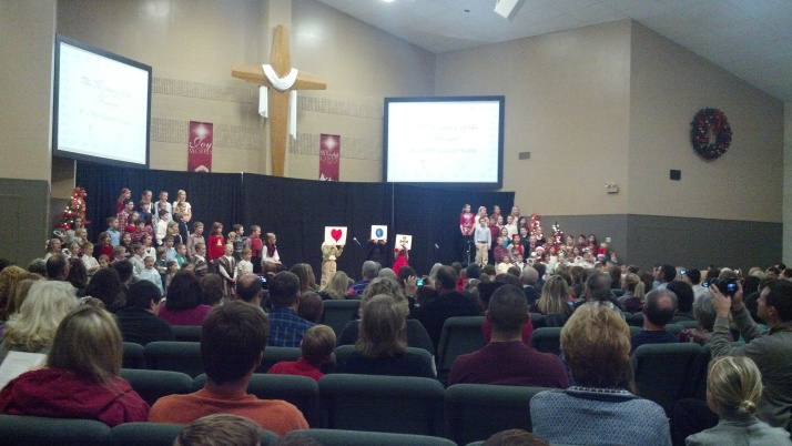 S in his school Christmas program.  He is holding the heart.