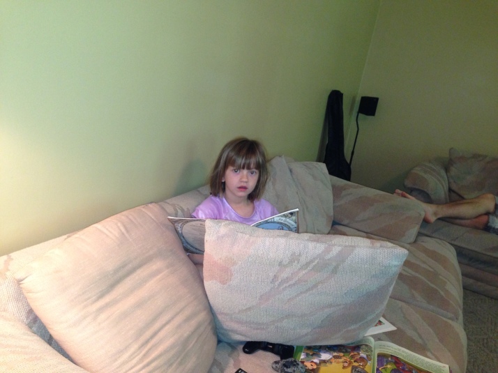 A buried herself in cushions to read because she was freezing cold.