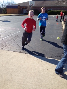 S racing to the finish after a 1 mile fun run